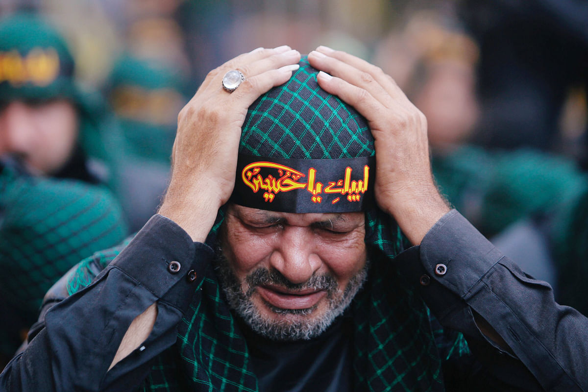 A Lebanon`s Hezbollah supporter mourns Imam Hussein during last day of Ashura, Beirut, Lebanon on 20 September 2018.