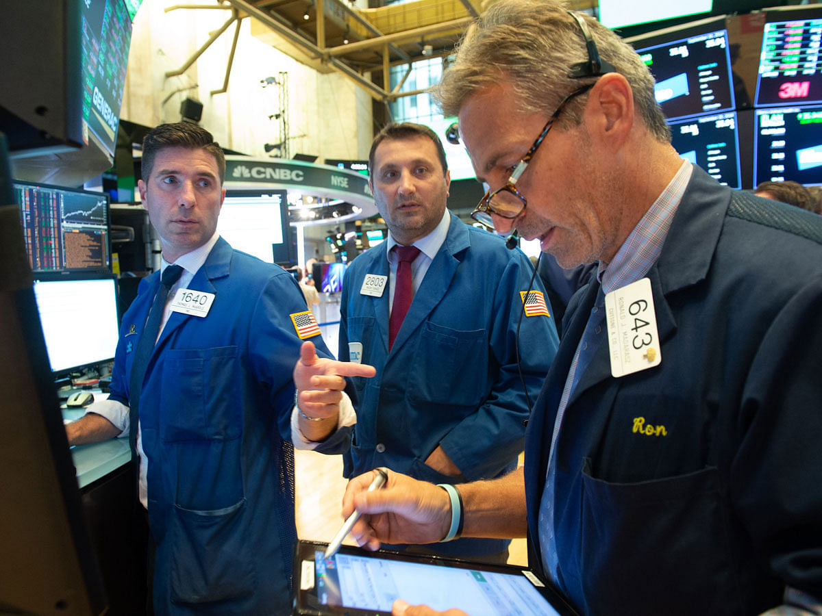 Traders work on the floor at the closing bell of the Dow Industrial Average at the New York Stock Exchange on 20 September, 2018 in New York. Photo: AFP