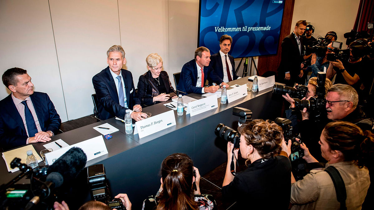 Board member of Denmark`s largest lender Danske Bank Ole Andersen, CEO Thomas Borgen, vice-chairwoman of the board Carol Sergeant, board member Jorn P Jensen and attorney Ole Spiermann give a press conference about the money laundering scandal in the bank at the Tivoli Kongres Center in Copenhagen on 19 September 2018. Borgen has resigned as a result of money laundering scandals, Danske Bank said in a stock exchange announcement 19 September 2018. Danske Bank also said it was unable to determine the amount of money believed to have been laundered through its Estonian branch between 2007 and 2015. - Photo -- AFP