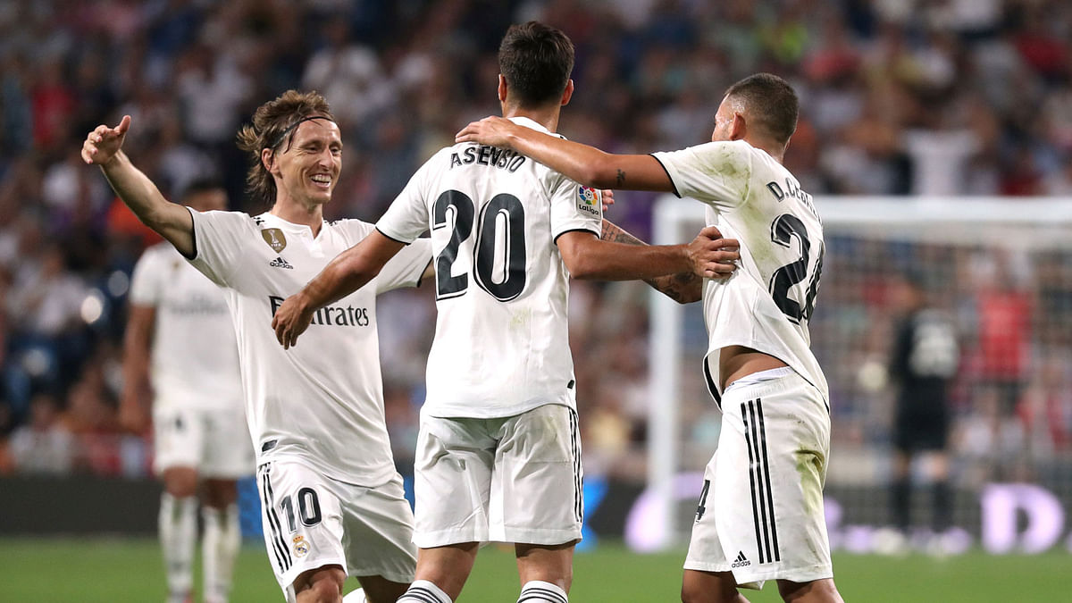 Real Madrid`s Marco Asensio celebrates scoring their first goal with team mates in a La Liga match against Espanyol at Santiago Bernabeu, Madrid, Spain on 22 September 2018. Photo: Reuters