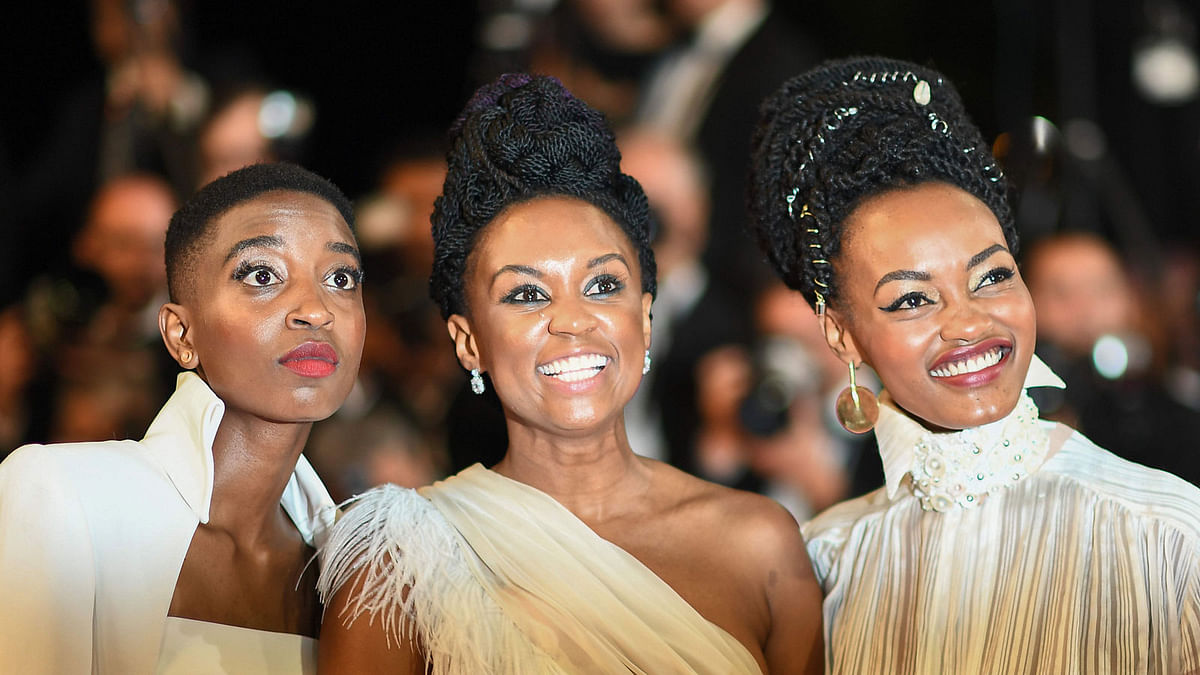 In this file photo taken on 9 May Kenyan actress Samantha Mugatsia, Kenyan director Wanuri Kahiu and Kenyan actress Sheila Munyiva pose as they arrive for the screening of the film `Rafiki` at the 71st edition of the Cannes Film Festival in Cannes, southern France. Photo: AFP