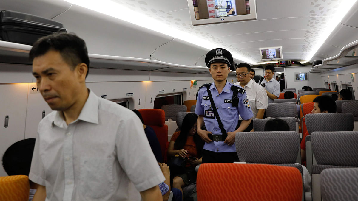 A China policeman patrols a train on the first day of service of the Guangzhou-Shenzhen-Hong Kong Express Rail Link in Hong Kong on 23 September 2018. Photo: AFP