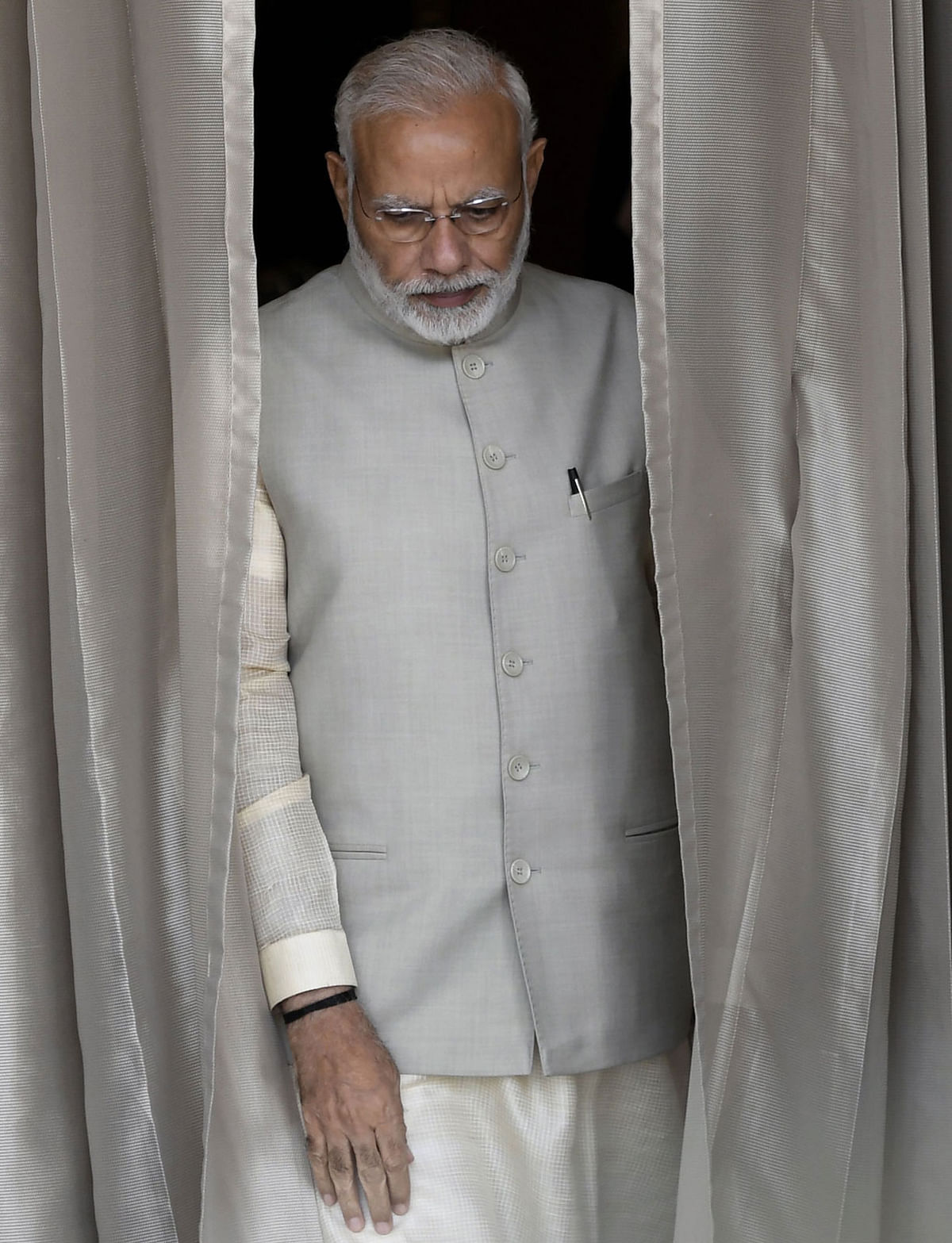 Indian prime minister Narendra Modi walks out before a meeting with Afghan President Mohammad Ashraf Ghani at Hyderabad House in New Delhi on 19 September. Photo: AFP