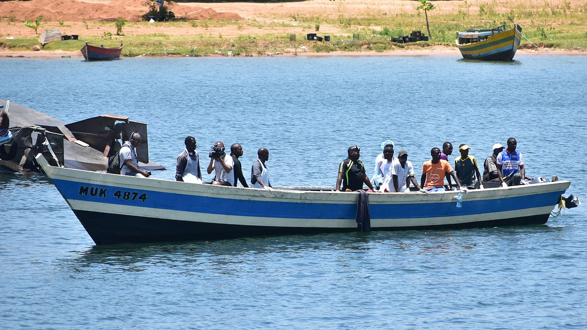 Rescuers sit in a boat on Lake Victoria on 22 September, 2018, during searches for victims a day after the ferry MV Nyerere capsized. Photo: AFP