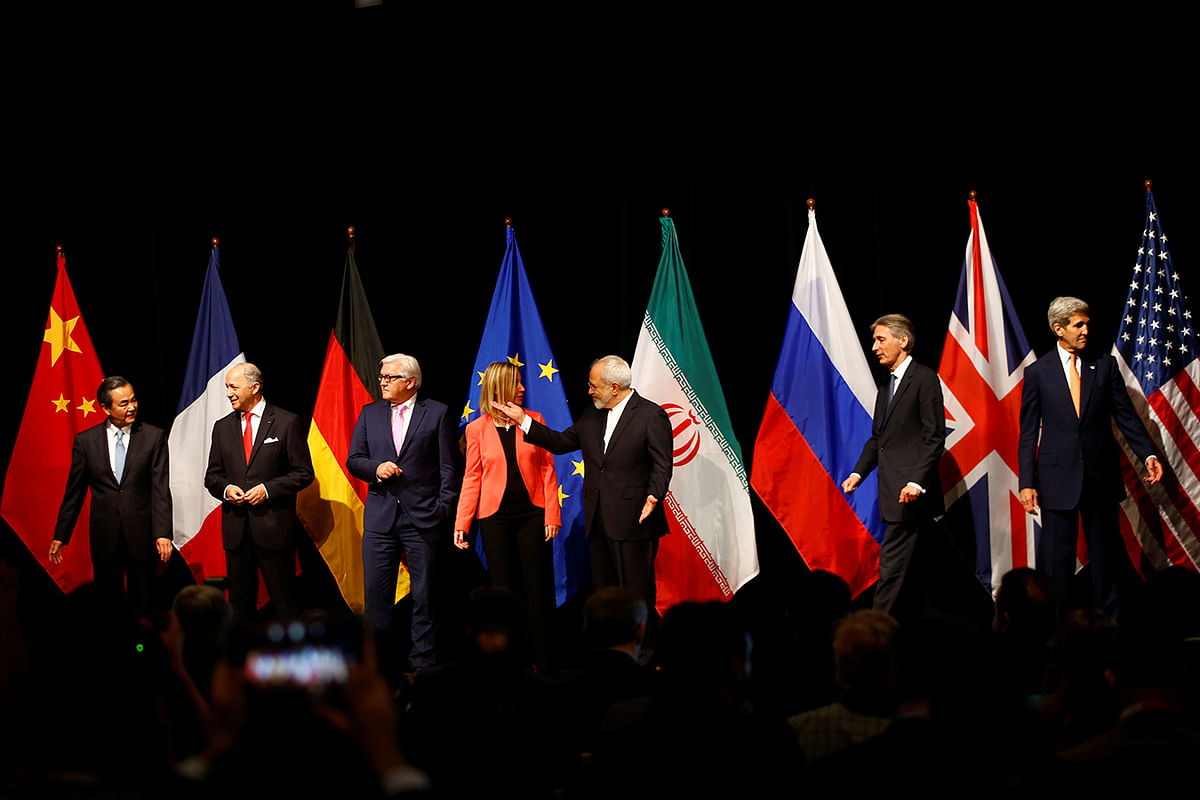 Ministers and officials including Iran’s foreign minister Javad Zarif arrive for a family picture after the last plenary session at the United Nations building in Vienna. Photo: Reuters