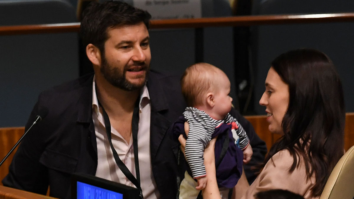 Jacinda Ardern, prime minister and Minister for Arts, Culture and Heritage, and National Security and Intelligence of New Zealand holds her son Neve Te Aroha Ardern Gayford, as her husband Clarke Gayford looks on during the Nelson Mandela Peace Summit 24 September 2018. Photo: AFP