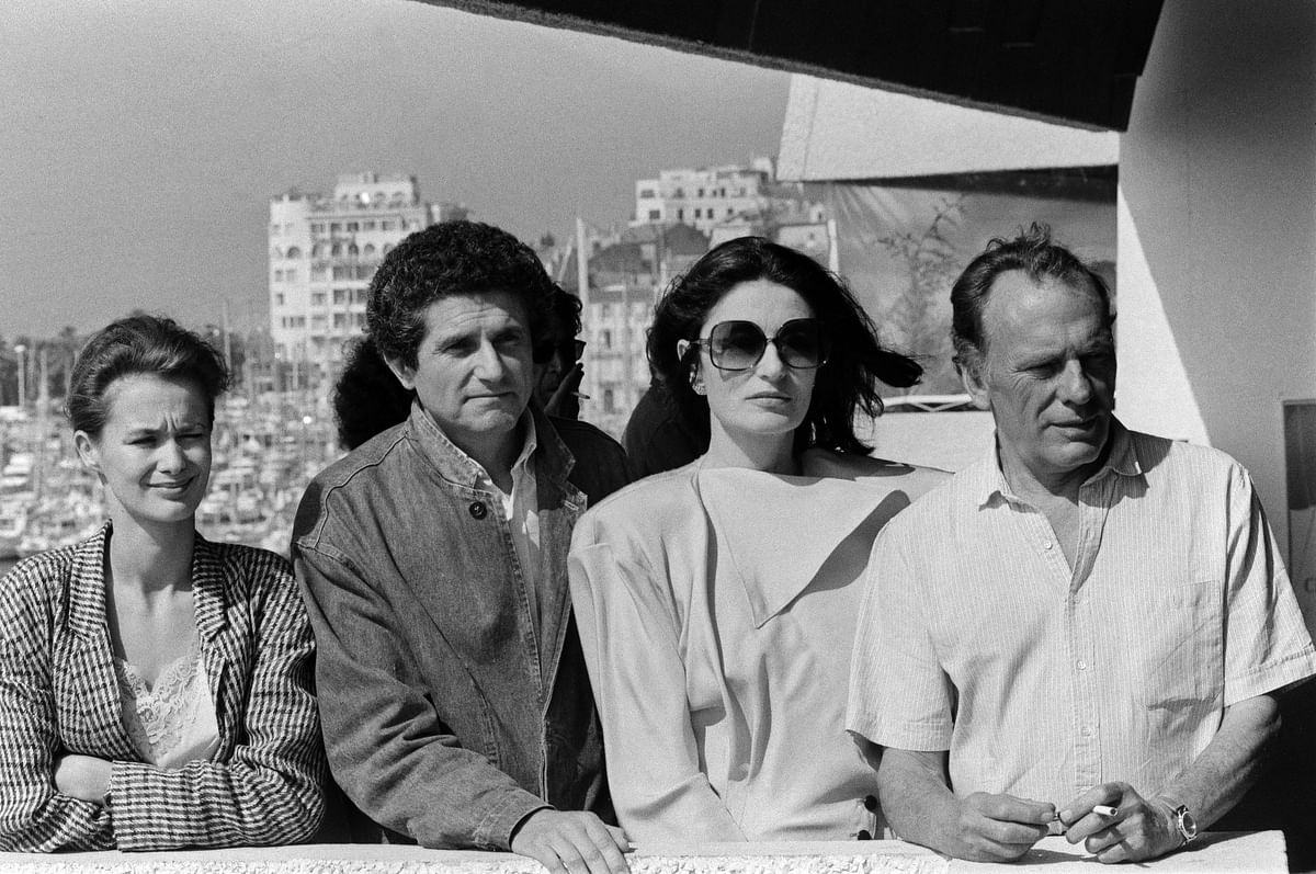 In this file photo taken on 12 May 1986 (from R) French actor Jean-Louis Trintignant, actress Anouk Aimee, director Claude Lelouch and his wife Marie-Sophie, pose during a press conference at the 39th edition of the Cannes Film Festival, southern France. Photo: AFP