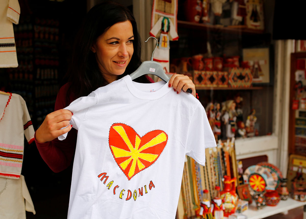 Tourists look at souvenirs with Macedonian flag on at the Old Bazar in Skopje, Macedonia on 29 September. Photo: Reuters