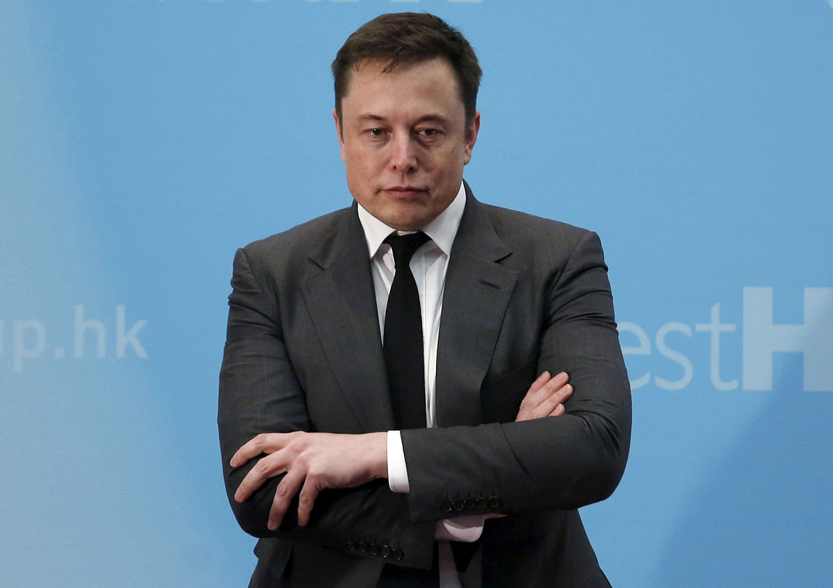 Tesla chief executive Elon Musk stands on the podium as he attends a forum on startups in Hong Kong, China on 26 January, 2016. Photo: Reuters
