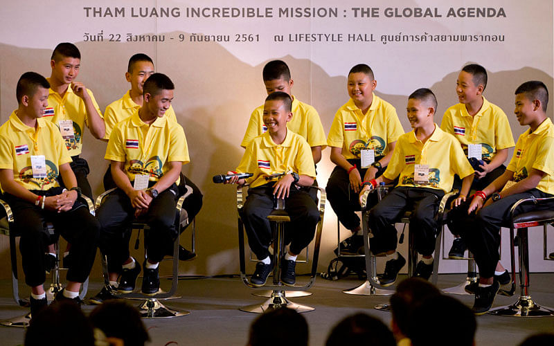 In this Thursday, 6 September 2018, file photo, members of the Wild Boars soccer team laugh during a media conference. Photo: AP  Thai cave boys head out on overseas tour