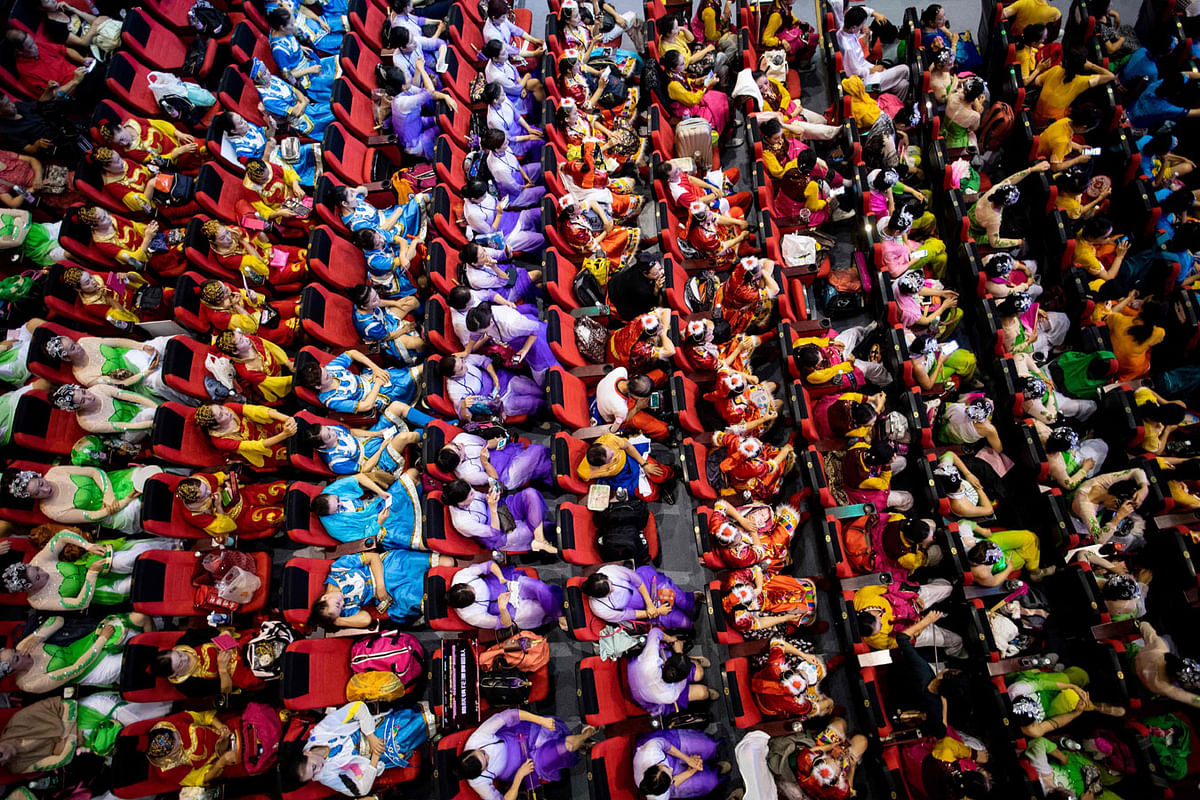 This picture taken on 25 August 2018 shows square dancers sit in the audience room, at the final round of a city-wide square dance competition at a local theatre in Shanghai. Photo: AFP