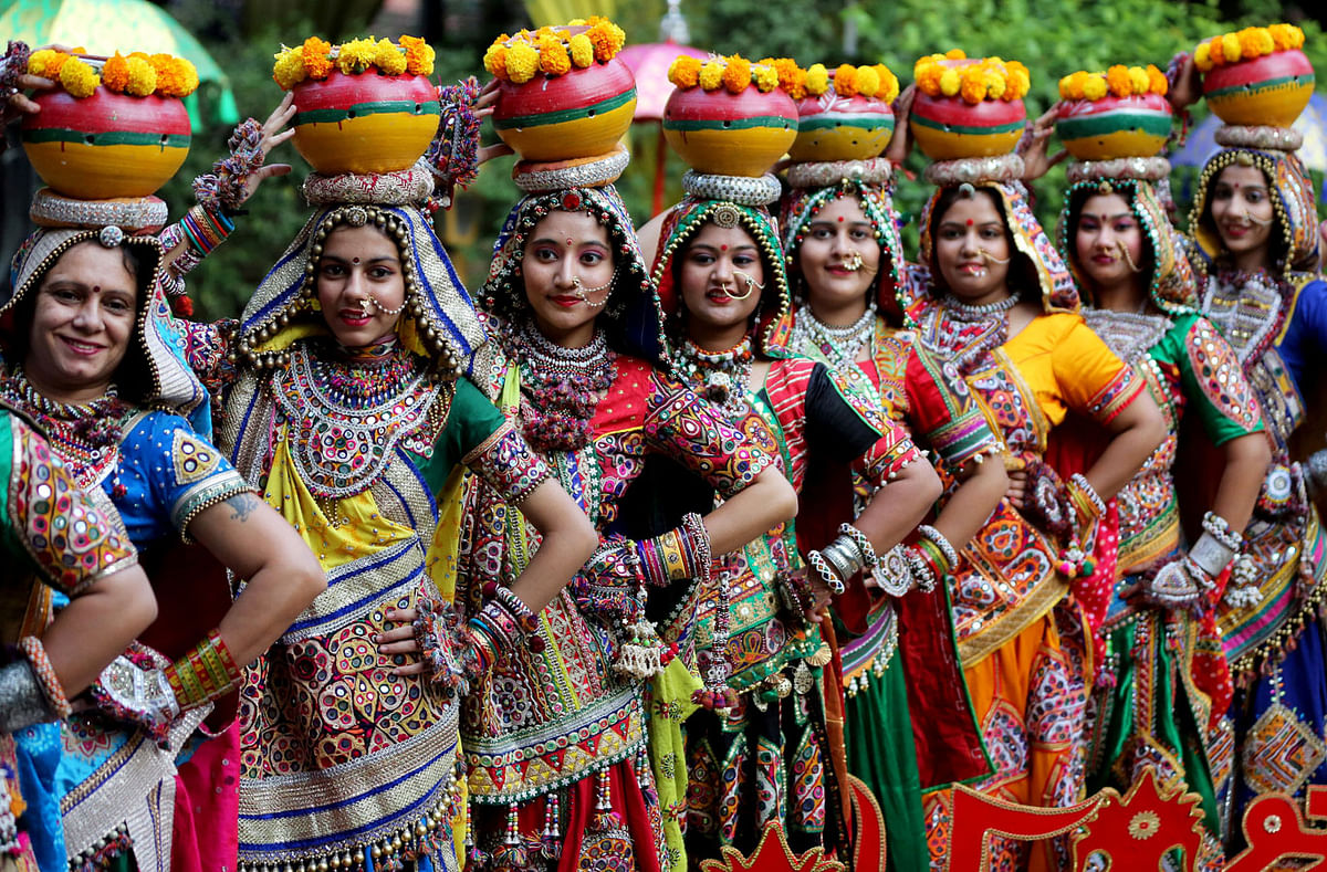 Women pose for pictures during rehearsals for Garba, a folk dance, ahead of Navratri, a festival during which devotees worship the Hindu goddess Durga and youths dance in traditional costumes, in Ahmedabad, India on 5 October 2018. Photo: Reuters