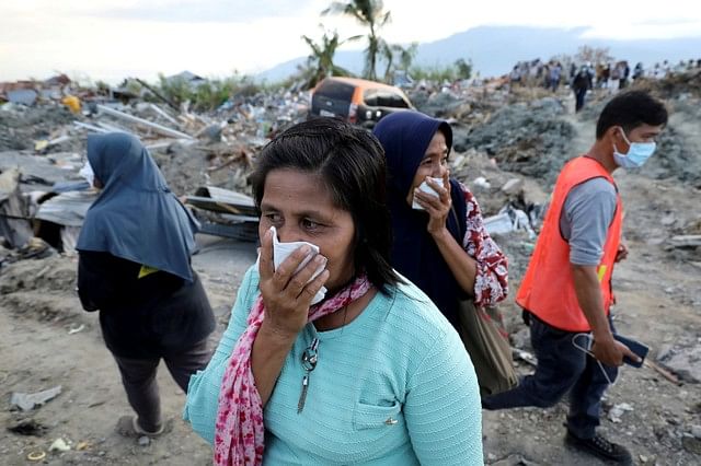 Women react while visiting Petobo neighbourhood which was hit by an earthquake and liquefaction in Palu, Central Sulawesi, Indonesia 8 October 2018. Photo: Reuters