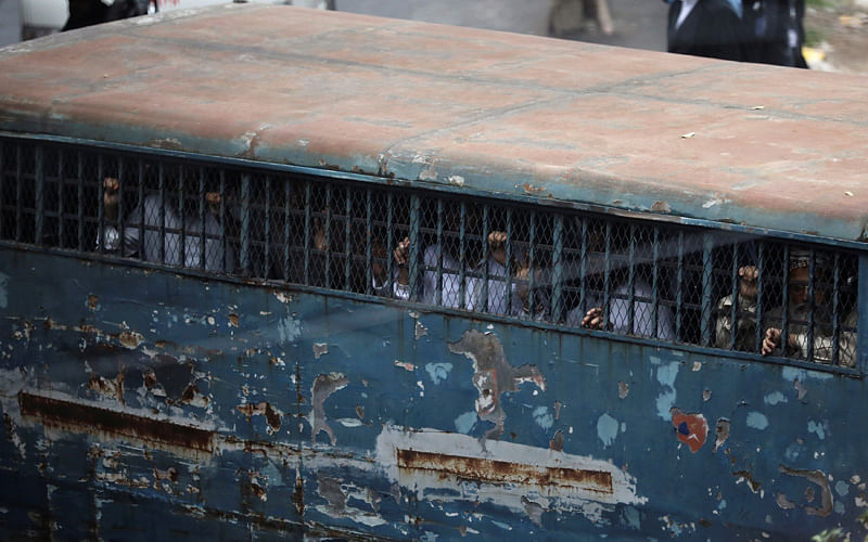 The accused are seen inside a prison van outside of the court after the verdict in the 21 August 2004 grenade attack case in Dhaka, Bangladesh on 10 October 2018. Photo: Reuters
