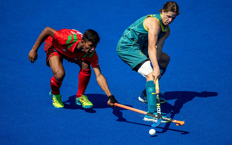 Sawon Sarower from Bangladesh and Australia`s Ben White challenge for the ball in the Hockey`s Mens Tournament Preliminary Round Pool B match between Australia and Bangladesh at the Hockey Field, Youth Olympic Park during The Youth Olympic Games, Buenos Aires, Argentina on 8 October 2018. Photo: Reuters