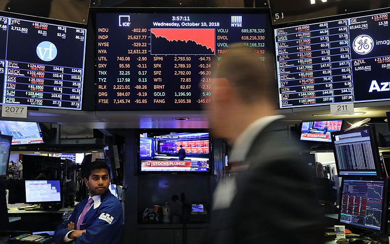 Traders work on the floor of the New York Stock Exchange (NYSE) on 10 October 2018 in New York City. Photo: AFP