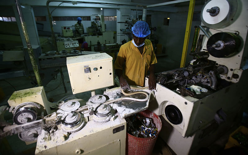 An employee works at the factory of food items and beverages owned by Sudanese businessman Samir Gasim, in the capital Khartoum on 20 September 2018. Photo: AFP
