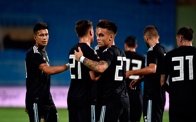 Argentina’s Lautaro Martinez © celebrates his goal with teammates during a friendly football match between Argentina and Iraq at the Faisal bin Fahd Stadium in Riyadh on 11 October 2018. Photo: AFP