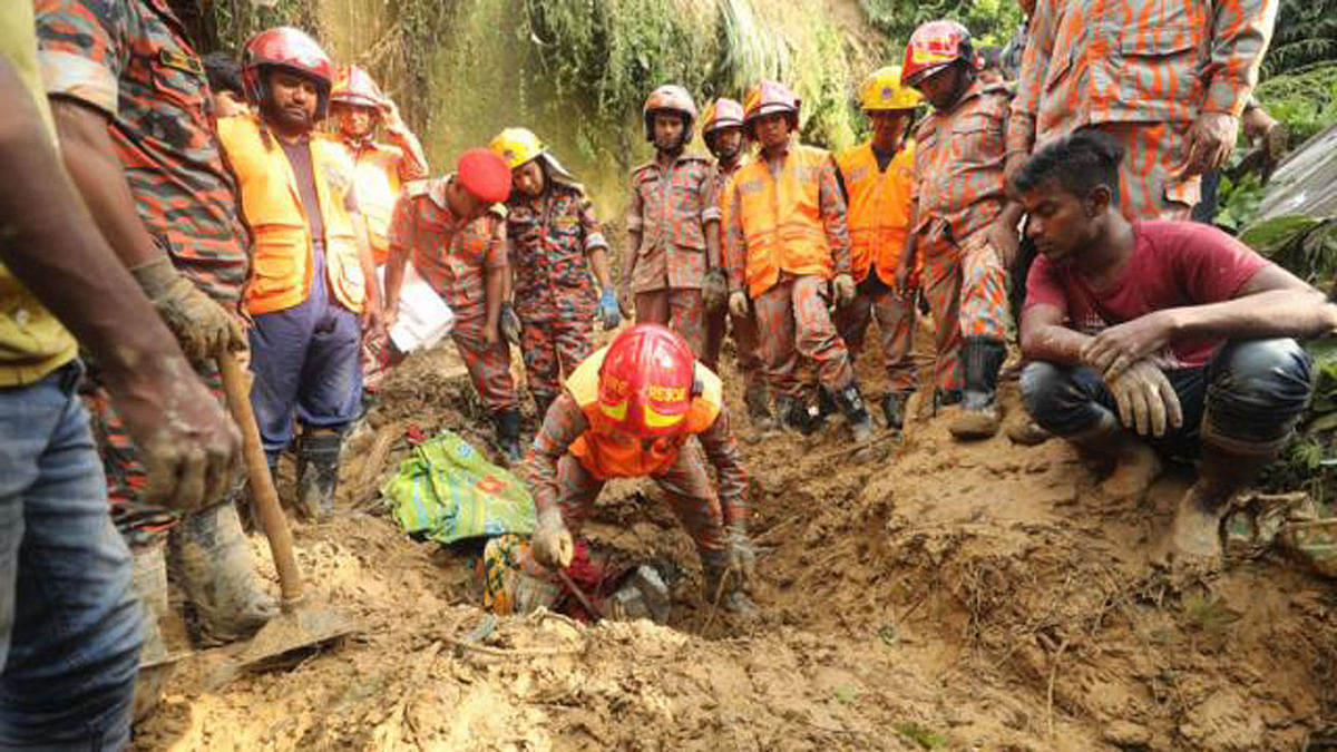 Fire service men conduct rescue work to recover the bodies. Photo: Sourav Das