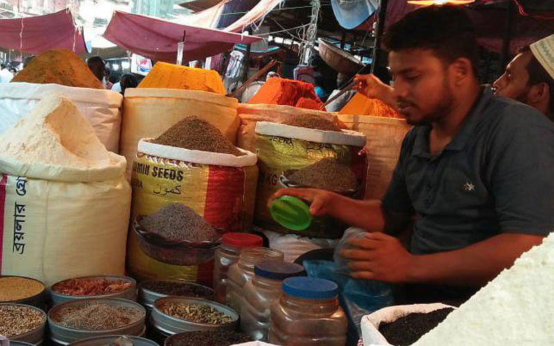 A seller working in his shop at Karwan Bazar, Dhaka. Photo: Nusrat Nowrin