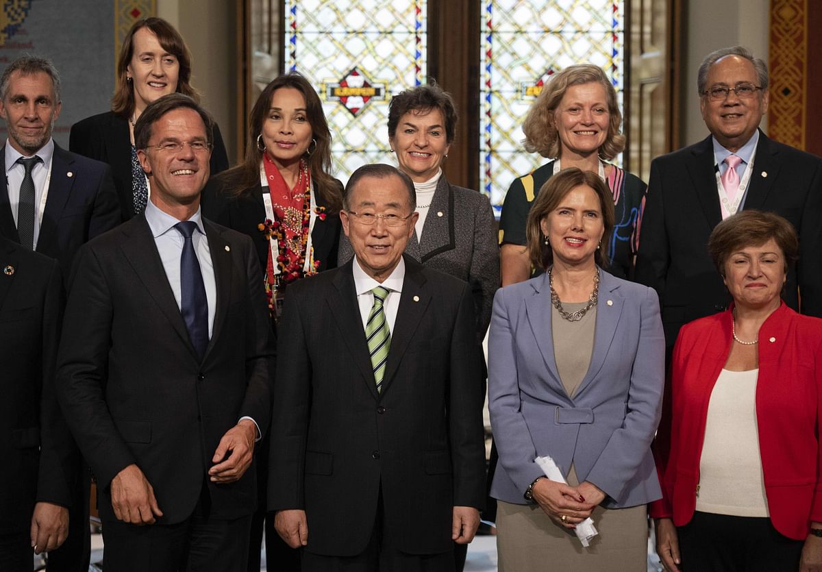 Dutch prime minister Mark Rutte, former head of the United Nations Ban-ki Moon and Dutch minister Van Nieuwenhuizen, pose in a group photograph at the launch of the Global Commission on Adaptation (GCA) in The Hague on 16 October 2018. Photo: AFP