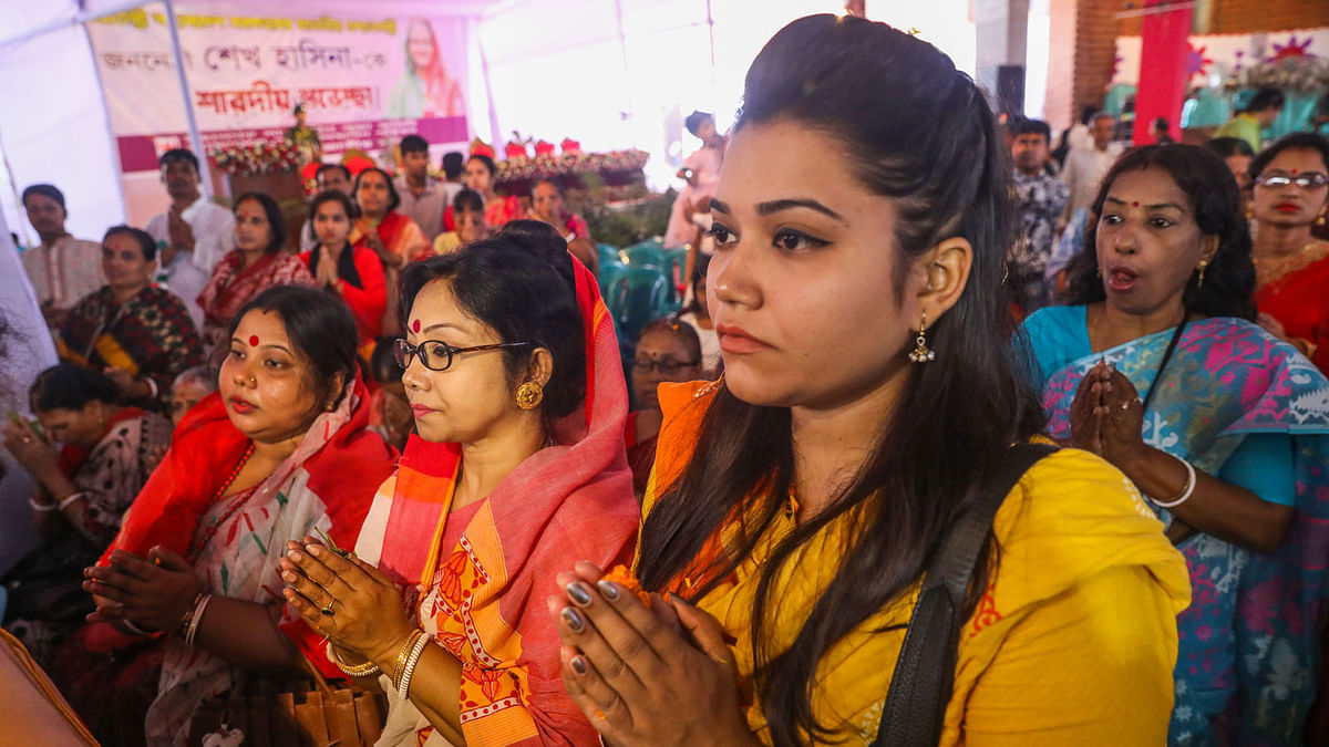 Devotees before the idol of goddess Durga at temple in Dhaka on 15 October.