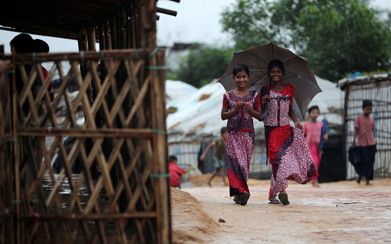 Rohingya refugee girls walk along the Kutupalong camp in Cox`s Bazar, Bangladesh, 13 October, 2018. Photo: Reuters
