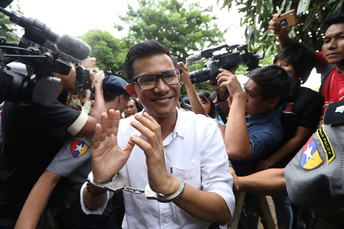 Kyaw Zaw Linn, the editor in charge at Eleven Media arrives after being detained at Tamwe court in Yangon, Myanmar on 10 October. Photo: Reuters