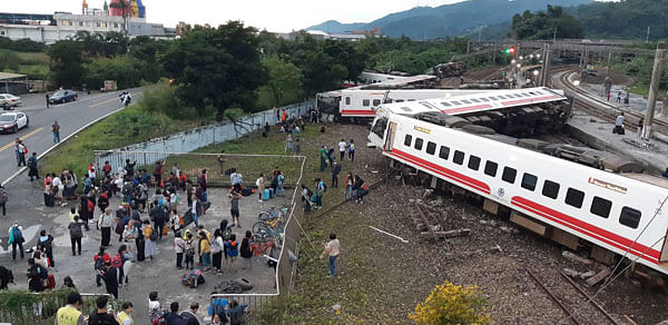 This CNA handout picture taken on 21 October 2018 shows a derailed train in Yian, eastern Taiwan. At least 17 people have died after a train derailed and flipped over in Taiwan, authorities said. Photo: AFP