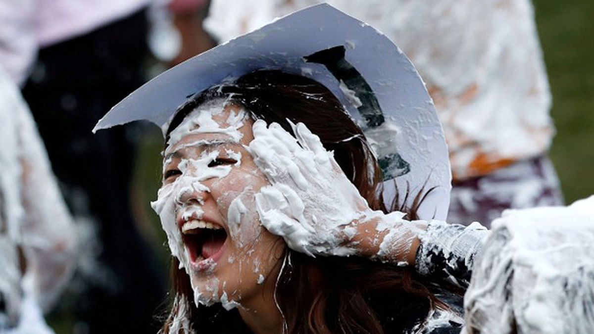 Students from St Andrews University are covered in foam as they take part in the traditional `Raisin Weekend` in the Lower College Lawn, at St Andrews in Scotland, Britain 22 October 2018. Photo: Reuters