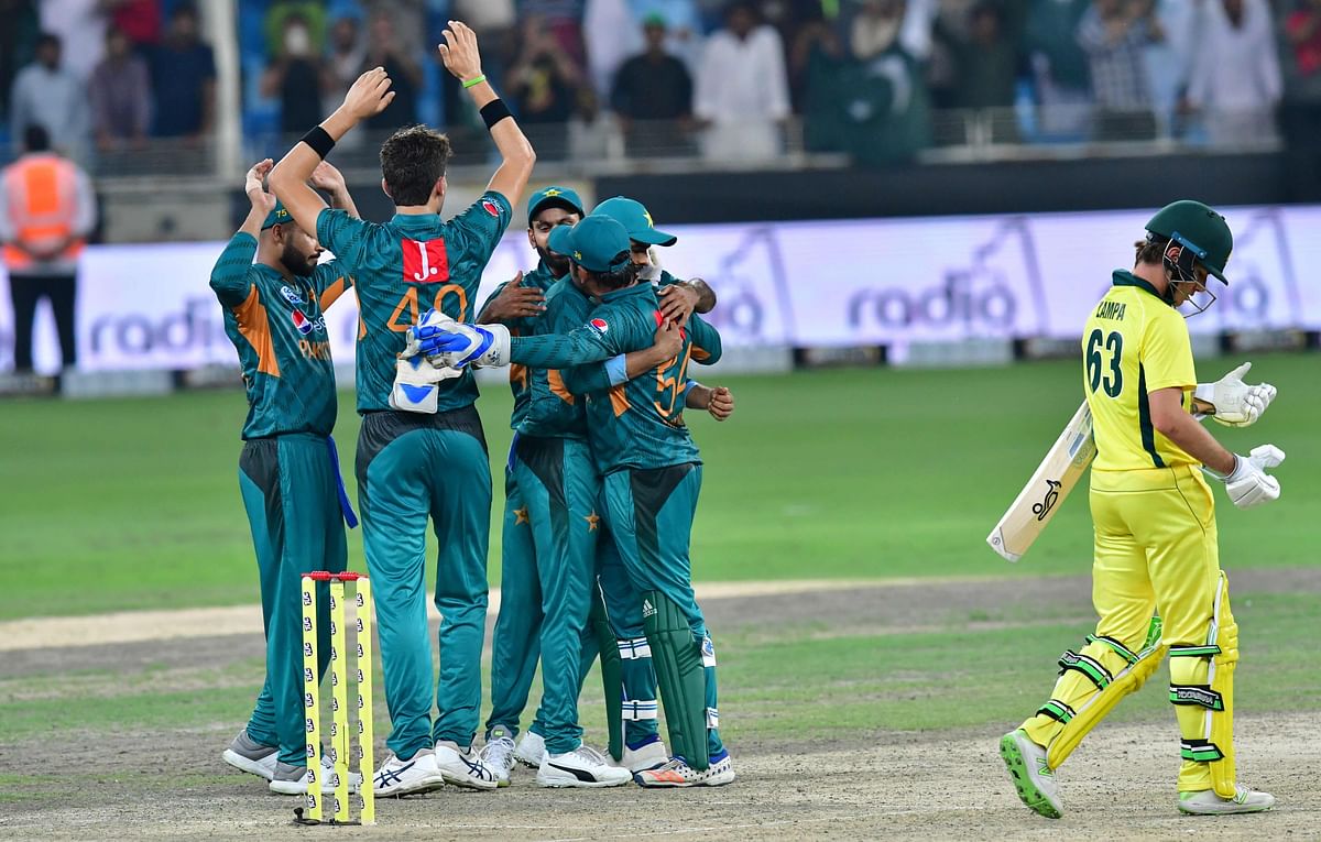 Pakistan cricketers celebrate after victory in the second T20 cricket match between Pakistan and Australia at The International Cricket Stadium in Dubai on 26 October 2018. Photo: AFP