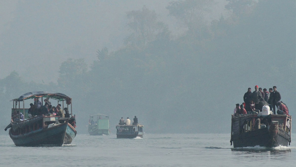 People on crossing the Kaptai Lake on boats in Balukhali, Rangamati on 30 October. Photo: Supriya Chakma