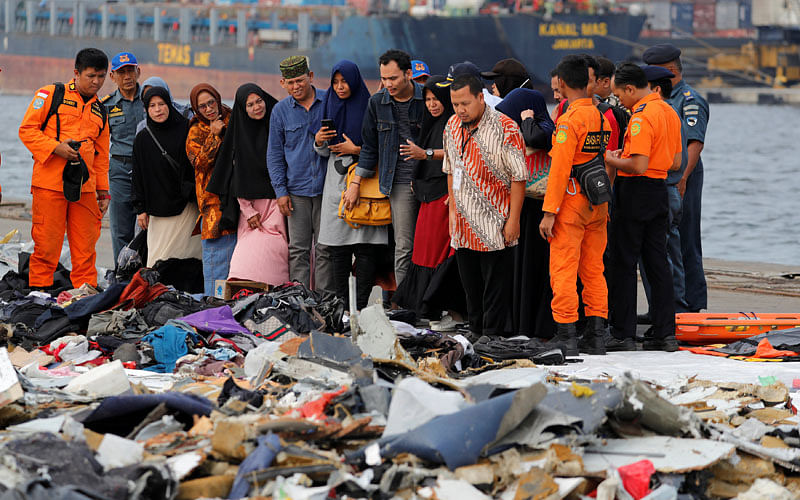 Families of passengers of Lion Air flight JT610 stand as they look at the belongings of the passengers at Tanjung Priok port in Jakarta, Indonesia, on 31 October 2018. Reuters