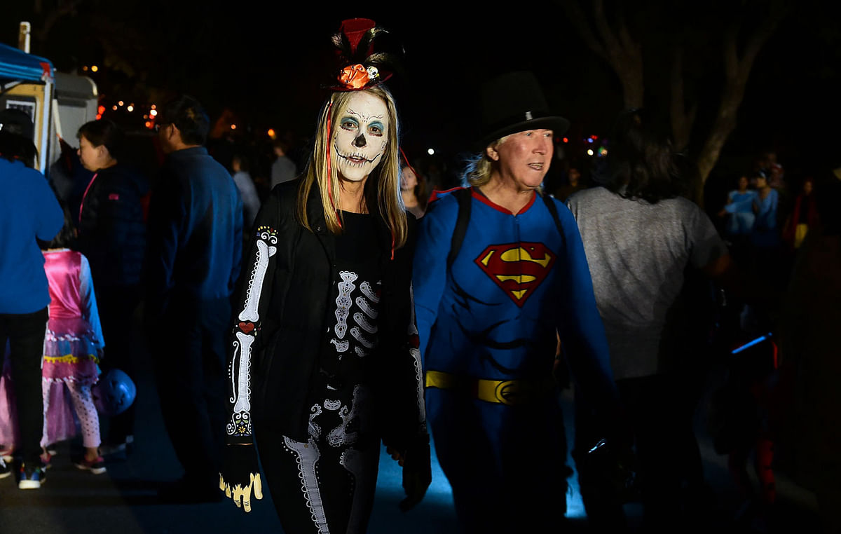 Trick or Treaters out for a walk on a street popular for its tradition of home decorations on Halloween Night in Sierra Madre, east of Los Angeles, on 31 October 2018. Photo: AFP