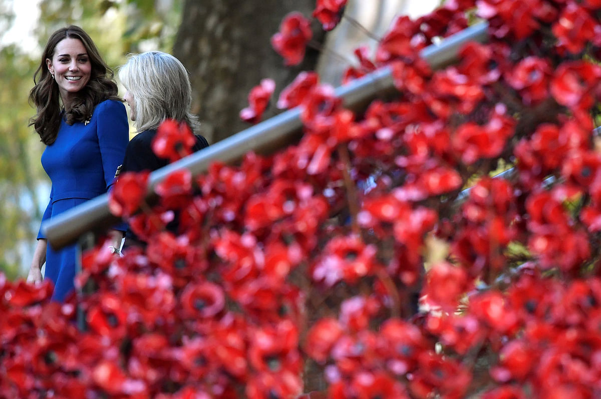 Britain`s Catherine, the Duchess of Cambridge, walks past the Weeping Window ceramic poppies installation as she leaves the Imperial War Museum, in London, Britain, 31 October 2018. Photo: Reuters