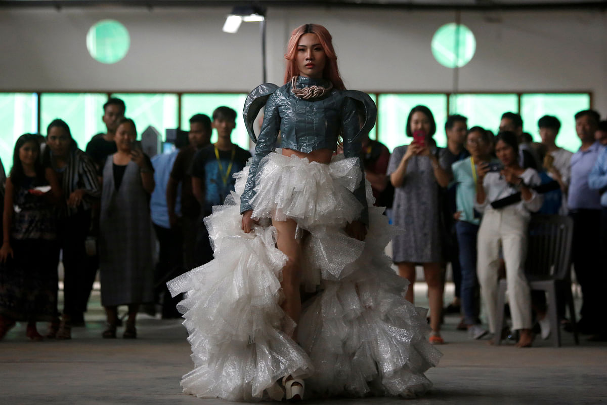 A model wears a dress made out of recycled material during a show organised by LGBT fashion designers to battles discrimination in Phnom Penh, Cambodia, 24 October 2018. Photo: Reuters
