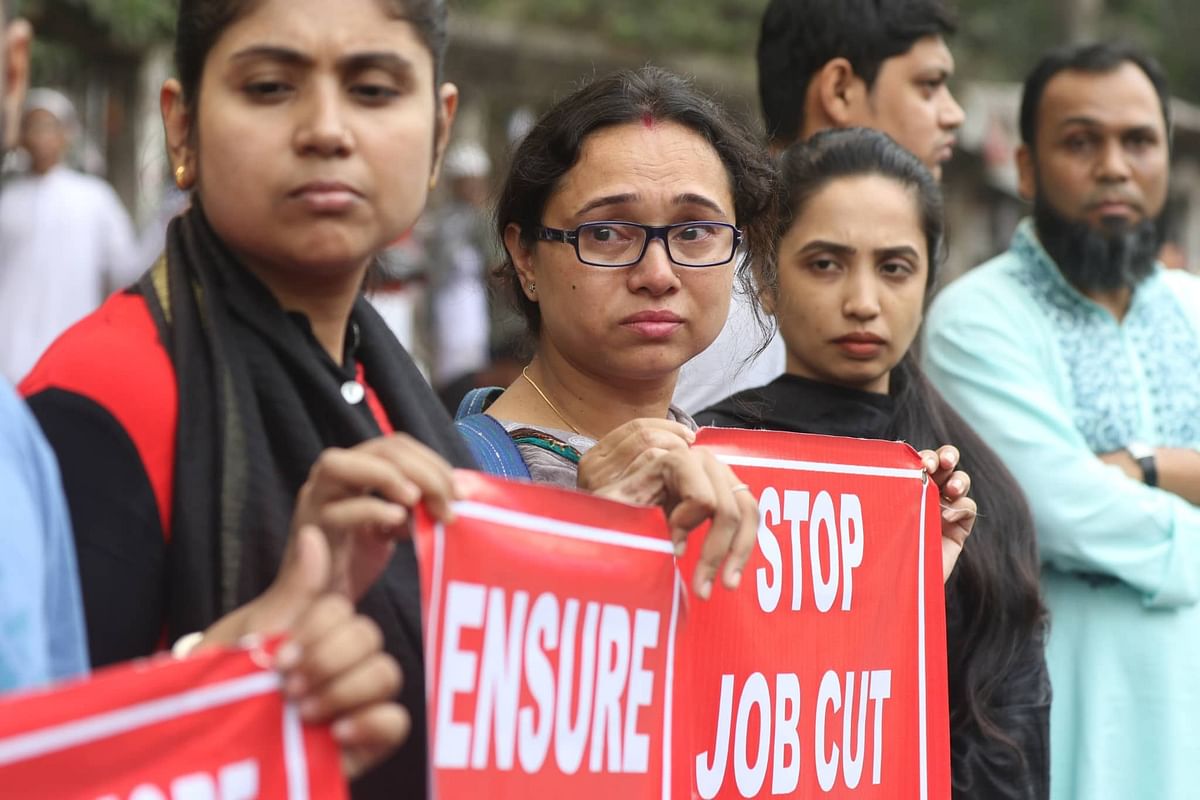 The employees of Grameen Phone have formed a human chain and press conference before the National Press Club as they fear to lose their jobs and also demanded to meet 11 other points on Friday. Photo: Abdus Salam