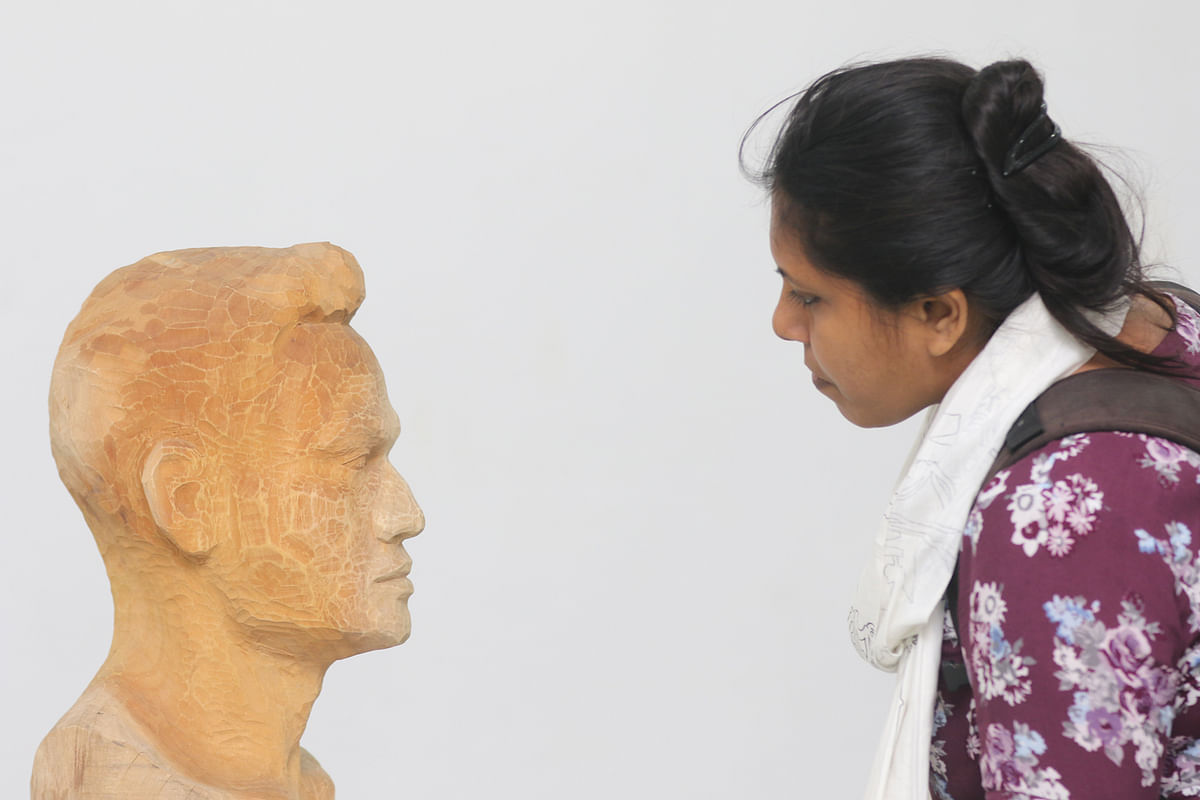 A visitor looks at a sculpture in the weeklong annual artworks exhibition at Jainul Gallery, Arts Faculty at Dhaka University on 2 November. Photo: Abdus Salam