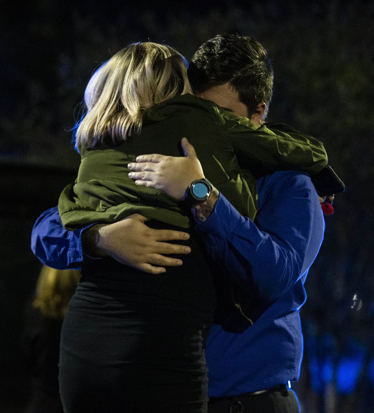 Nick Cessna, right, confronts his girlfriend Melissa Hutchinson who rendered aid to some of the victims of a mass shooting on 2 November 2018 in Tallahassee, Florida. Photo: AFP