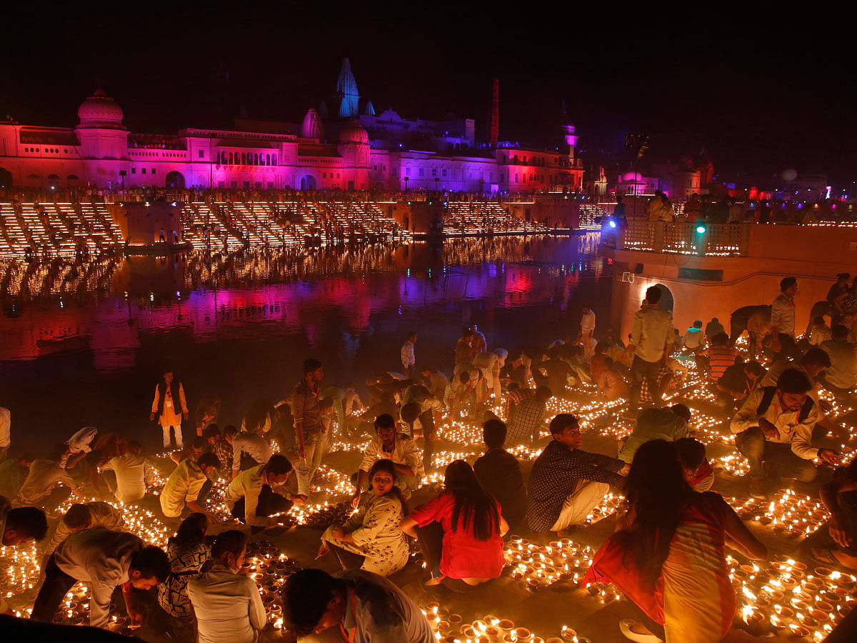 Devotees light earthen lamps on the banks of the River Sarayu as part of Diwali celebrations in Ayodhya, India, India, Tuesday, 6 November 2018. The north Indian City of Ayodhya made an attempt to break the Guinness Book of World record when several earthen lamps were lit at the banks of river Saryu on the occasion of Diwali – the festival of light. Photo: AP