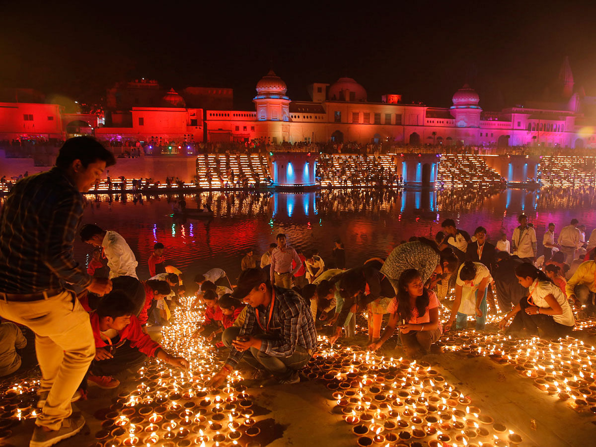Devotees light earthen lamps on the banks of the River Sarayu as part of Diwali celebrations in Ayodhya, India, India, Tuesday, 6 November 2018. The north Indian City of Ayodhya made an attempt to break the Guinness Book of World record when several earthen lamps were lit at the banks of river Saryu on the occasion of Diwali – the festival of light. Photo: AP