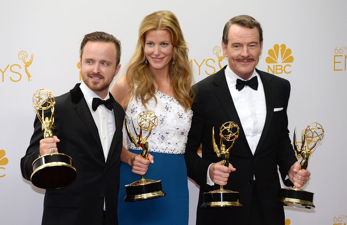 In this file photo taken on 26 August 2014, actors Aaron Paul (L), Anna Gunn (C) and Bryan Cranston (R) pose in the press after winning the Outstanding Drama Series Award, Outstanding Lead Actor in a Drama Series Award, Outstanding Supporting Actor in a Drama Series Award and Outstanding Supporting Actress in a Drama Series Award for `Breaking Bad` during the 66th Emmy Awards in Los Angeles. Photo: AFP