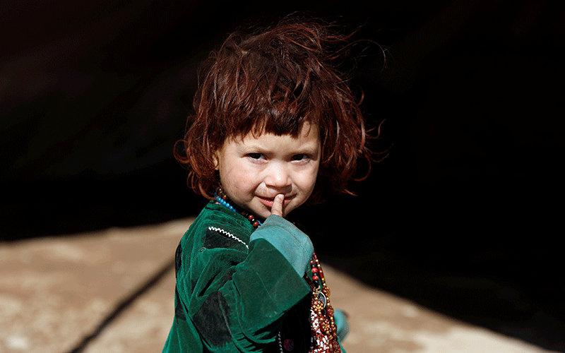 An internally displaced Afghan child looks on at a refugee camp in Herat province, Afghanistan. The picture taken on 14 October 2018. Photo: Reuters