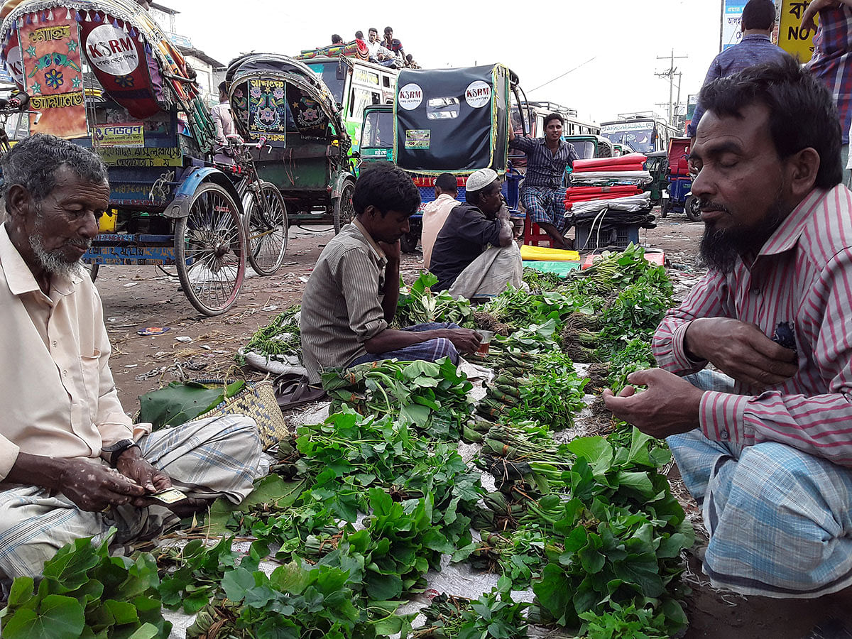 Farmers selling vegetable seedlings at Chatri Choumuhoni Bazar, Anwara in Chattagram. A recent photo by Mohammad Morshed Hossain