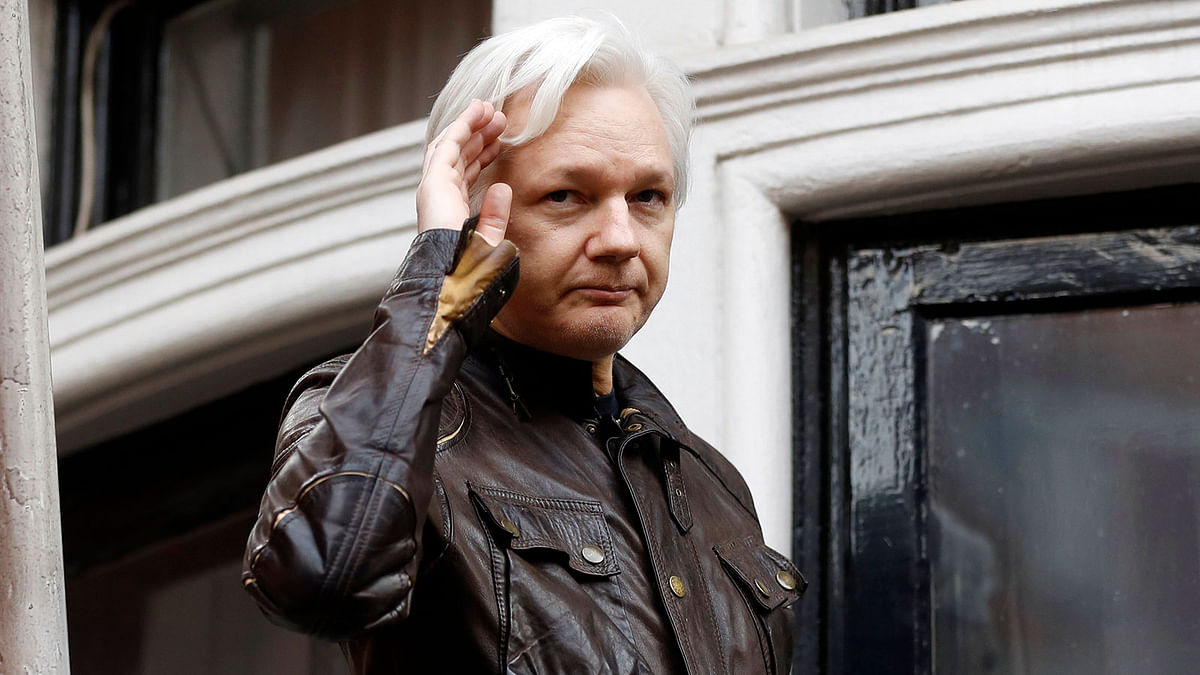 In this 19 May, 2017, file photo, WikiLeaks founder Julian Assange greets supporters from a balcony of the Ecuadorian embassy in London. Photo: AP