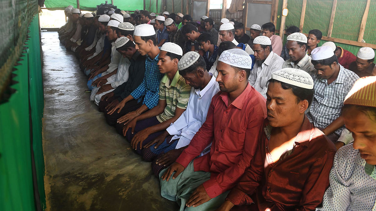 Rohingya Muslim refugees take part in Friday prayers at the Balukhali refugee camp in the Ukhia area of Bangladesh on 16 November, 2018. Photo: AFP  Rohingyas pray for thanks after repatriation halted