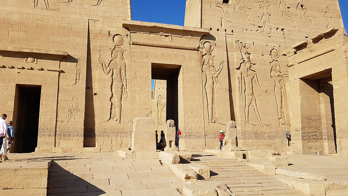 Aaryan and Aariz with their mother in front of Philae temple