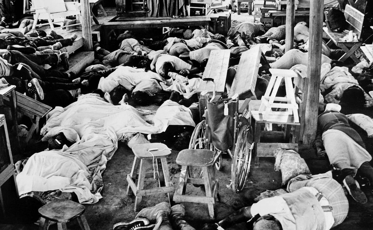 In this file photo taken on 19 November 1978 bodies of more than 400 members of the Jim Jones` sect `Temple of people` lie down, in Jonestown, where the Cult leader Jim Jones had established the Peoples Temple. Photo: AFP