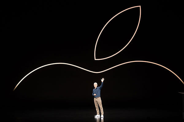 In this file photo taken on 12 September 2018 Apple CEO Tim Cook waves to the audience during an event in Cupertino, California. Photo: AFP