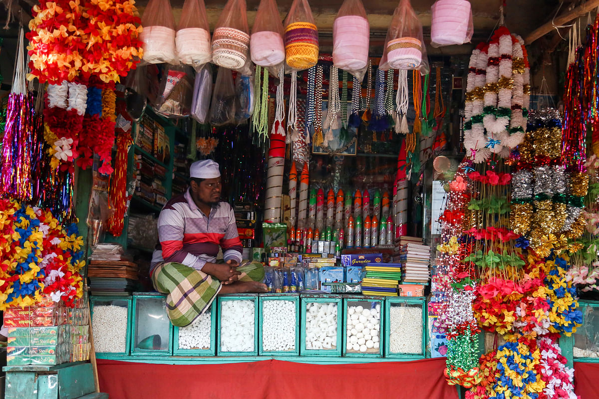 A shopkeeper sitting amid items usually used by devotees for visiting a shrine. The photo has been taken from the shrine of Shah Ali in Dhaka`s Mirpur-1 on 19 November by Sabrina Yesmin.